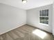 Cozy bedroom with a large window providing natural light at 129 Bridges Ln, Youngsville, NC 27596