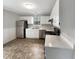 Well-lit kitchen with stainless steel appliances and ample counter space at 129 Bridges Ln, Youngsville, NC 27596