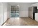 Eat-in kitchen area with stainless steel appliances and sliding door to the deck at 129 Bridges Ln, Youngsville, NC 27596