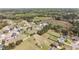 Neighborhood aerial view featuring homes with large yards, mature trees, and a lush green landscape at 14 E Saddle Ct, Archer Lodge, NC 27527