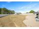 Expansive fenced backyard with a gravel area, perfect for outdoor entertaining, and access to the detached structure at 14 E Saddle Ct, Archer Lodge, NC 27527
