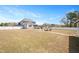 Spacious, fenced yard offering outdoor living and entertainment space, with a fire pit and patio area at 14 E Saddle Ct, Archer Lodge, NC 27527
