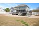 The back of this home has a screened in porch, deck, hot tub and is partially fenced at 14 E Saddle Ct, Archer Lodge, NC 27527