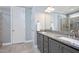 Bathroom features double vanity, granite countertops, gray cabinets and modern lighting at 14 E Saddle Ct, Archer Lodge, NC 27527