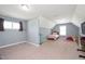 Bedroom with neutral carpet, blue walls and good natural light from the two windows at 14 E Saddle Ct, Archer Lodge, NC 27527