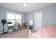 Bedroom with a large window, light blue walls, neutral carpet and a desk at 14 E Saddle Ct, Archer Lodge, NC 27527