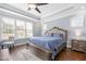 Spacious bedroom features light blue walls, hardwood floors and a tray ceiling at 14 E Saddle Ct, Archer Lodge, NC 27527
