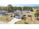 Aerial view of the property featuring a well-manicured lawn, a detached structure, and a spacious backyard at 14 E Saddle Ct, Archer Lodge, NC 27527