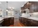 Eat-in kitchen with pendant lights, stainless steel appliances, island, and light-filled breakfast nook at 14 E Saddle Ct, Archer Lodge, NC 27527