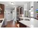 An eat-in kitchen features dark wood cabinets, stainless appliances, and quartz countertops at 14 E Saddle Ct, Archer Lodge, NC 27527