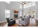 Bright living room with soaring ceilings, fireplace, hardwood floors, and sliding doors at 14 E Saddle Ct, Archer Lodge, NC 27527