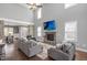 Spacious living room with soaring ceilings, fireplace, hardwood floors, and abundant natural light at 14 E Saddle Ct, Archer Lodge, NC 27527