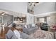 Bright open-concept floor plan with hardwood floors, a kitchen island, and stylish furnishings at 14 E Saddle Ct, Archer Lodge, NC 27527