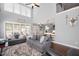 Open-concept living room featuring soaring ceilings, hardwood floors, and views of the kitchen at 14 E Saddle Ct, Archer Lodge, NC 27527