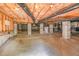 Spacious unfinished basement with visible support beams, water heater, and vapor barrier at 1409 Turner Farms Rd, Garner, NC 27529