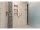 Large tiled shower with grab bar and built in shower niche shelves at 1409 Turner Farms Rd, Garner, NC 27529
