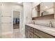 Bathroom featuring double sink vanity with stone countertops and walk in closet at 1409 Turner Farms Rd, Garner, NC 27529