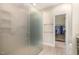 Bathroom with tiled floors, walk in closet and glass-enclosed shower at 1409 Turner Farms Rd, Garner, NC 27529