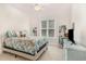Cozy bedroom with plush carpet, ceiling fan, and a bright window at 1409 Turner Farms Rd, Garner, NC 27529