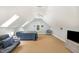 Spacious bonus room with carpet floors, skylights, and comfortable seating at 1409 Turner Farms Rd, Garner, NC 27529