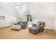 Attic bonus room with carpet floors, ceiling fan, and comfortable furniture at 1409 Turner Farms Rd, Garner, NC 27529