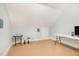 Attic bonus room with carpet floors, a door, and a small tv stand at 1409 Turner Farms Rd, Garner, NC 27529