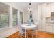 Charming breakfast nook with natural light, hardwood floors, and custom built-ins for a cozy and inviting dining experience at 1409 Turner Farms Rd, Garner, NC 27529