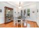 Inviting dining room with natural light, tray ceilings, hardwood floors, and classic decor offering a cozy space to dine at 1409 Turner Farms Rd, Garner, NC 27529