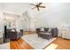 Open living room boasting hardwood floors, a vaulted ceiling, and neutral walls complemented by comfortable modern furnishings at 1409 Turner Farms Rd, Garner, NC 27529
