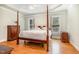 Main bedroom boasts hardwood floors, tray ceiling, and stylish furnishings at 1409 Turner Farms Rd, Garner, NC 27529
