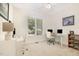Bright office with built-in shelving, hardwood floors, and natural light is an ideal space for a home office at 1409 Turner Farms Rd, Garner, NC 27529