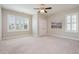 Bedroom features carpeted flooring, neutral walls, ceiling fan and a large window allowing natural light at 142 Old Piedmont Cir, Chapel Hill, NC 27516