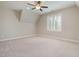 A bedroom featuring carpeted flooring, a neutral paint color and window with bright natural light at 142 Old Piedmont Cir, Chapel Hill, NC 27516