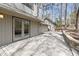 Exterior wooden deck featuring access to the home and guest house along with natural stone features at 1516 Cumberland Rd, Chapel Hill, NC 27514