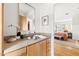 Ensuite bath with single vanity, granite countertop, and views into bedroom at 1516 Cumberland Rd, Chapel Hill, NC 27514