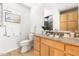 Bathroom featuring vanity, granite countertop, and tiled floors, with a bright and airy feel at 1516 Cumberland Rd, Chapel Hill, NC 27514