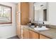 Bathroom showcasing vanity, wooden cabinetry, and a granite countertop at 1516 Cumberland Rd, Chapel Hill, NC 27514