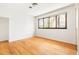 This bedroom features a large window that provides ample natural light and hardwood floors at 1516 Cumberland Rd, Chapel Hill, NC 27514