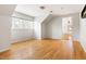 Empty bedroom showcasing natural light, hardwood floors, and an ensuite bathroom at 1516 Cumberland Rd, Chapel Hill, NC 27514