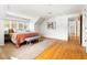 Spacious bedroom with hardwood floors, stylish decor, and ample natural light at 1516 Cumberland Rd, Chapel Hill, NC 27514