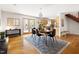 Open-concept dining room leading to kitchen with access to outdoor living space at 1516 Cumberland Rd, Chapel Hill, NC 27514