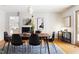 Dining room featuring modern decor, including a black fireplace and contemporary artwork at 1516 Cumberland Rd, Chapel Hill, NC 27514