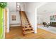 Foyer with hardwood floors and staircase leading to the second floor, showcasing the home's bright interior at 1516 Cumberland Rd, Chapel Hill, NC 27514