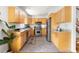 Spacious kitchen featuring natural wood cabinets, stainless steel appliances, and ample counter space at 1516 Cumberland Rd, Chapel Hill, NC 27514