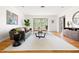 Bright and open living room with hardwood floors, modern decor, and plenty of natural light at 1516 Cumberland Rd, Chapel Hill, NC 27514