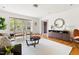 Inviting living room with hardwood floors, comfortable seating, and a large window with a scenic view at 1516 Cumberland Rd, Chapel Hill, NC 27514