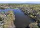 Expansive aerial view showcasing the lake and the surrounding properties with mature trees and scenic beauty at 155 Chimney Rise Dr, Cary, NC 27511