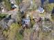 Birds eye view showing homes nestled in a wooded area, near a body of water at 155 Chimney Rise Dr, Cary, NC 27511