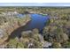 Picturesque aerial view highlighting the lake, homes, and beautiful landscape, creating a serene living environment at 155 Chimney Rise Dr, Cary, NC 27511