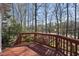 Expansive back deck offers a serene setting with mature trees and a view of the lake at 155 Chimney Rise Dr, Cary, NC 27511
